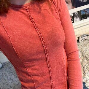 Free People orange long sleeve top with ruffle...